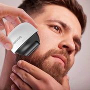 Man using Men's Portable Hair Growth beard roller microneedles for hair growth and beard care
