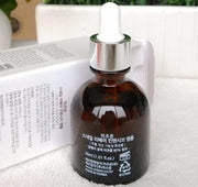 MIZON Snail Ampoules brown glass bottle with dropper for skin hydration and repair next to white box packaging