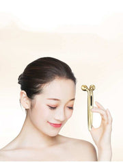 woman using 3D face-lifting device roller massager for skincare and facial firming