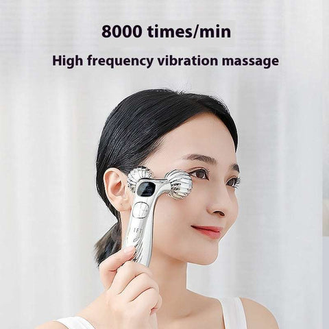 Woman using facial massager roller for skin tightening and lifting with high frequency vibration massage