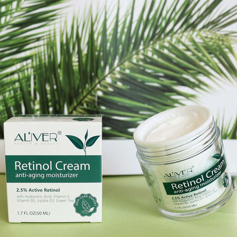 Aliver Retinol Cream anti-aging moisturizer with 2.5% active retinol in open jar and box with green leaf background