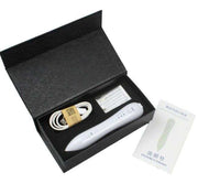 Spot Removal Pen kit with device, charging cable, tips, and instruction manual in black box