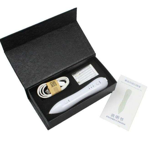 Spot Removal Pen kit with device, charging cable, tips, and instruction manual in black box