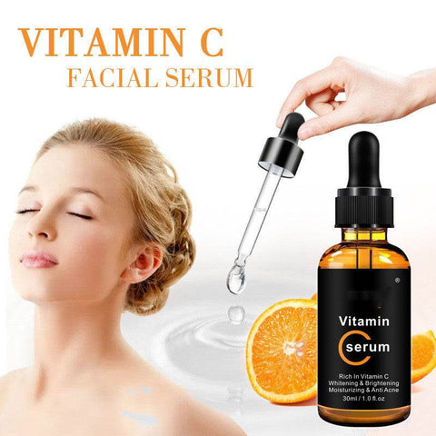 Vitamin C Stock Solution facial serum bottle with dropper, orange slice, and woman with glowing skin