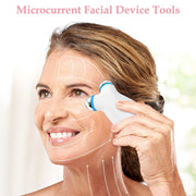 Woman using white microcurrent facial device to reduce wrinkles and firm skin