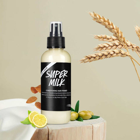 Hair Conditioner Spray bottle with natural ingredients like lemon, almonds, and wheat on a neutral background