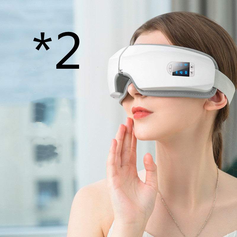 Woman using white eye massager headset for relaxation and reducing eye strain